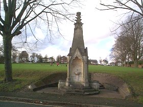 Oram's Arbour & Drinking Fountain  19th Century Littlehales Memorial. Square, carved stone fountain in shape of Gothic crocketted pinnacle. Two basins. Dated 1880. Formerly outside the Westgate.     SU 476 297